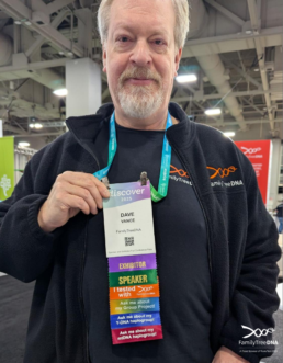 Dave Vance wearing a RootsTech conference badge with multiple ribbons indicating speaker and participant roles.