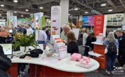 Attendees speaking with genetic genealogy experts during one-on-one consultations at the FamilyTreeDNA booth.