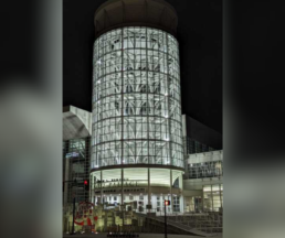 Exterior view of the Salt Palace Convention Center at night during RootsTech.